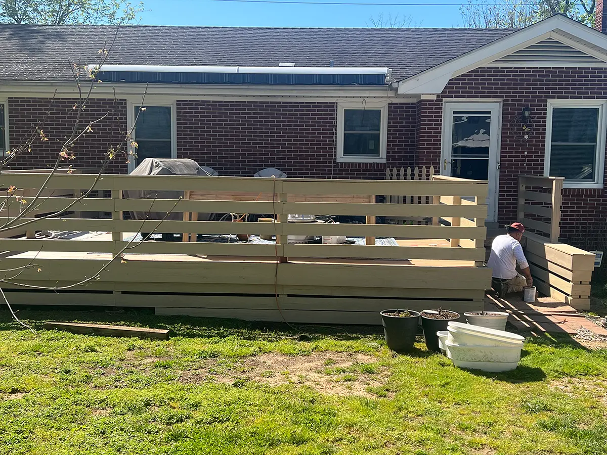 red brick house with wood deck