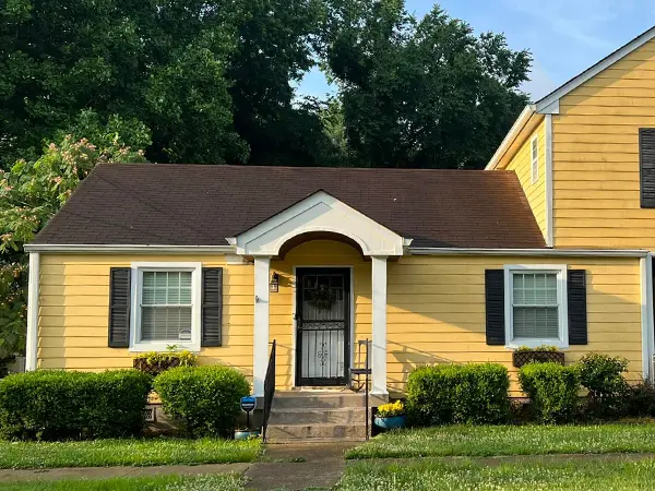 house painted in yellow and white