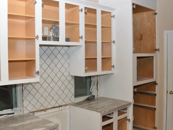 white kitchen cabinets and walls