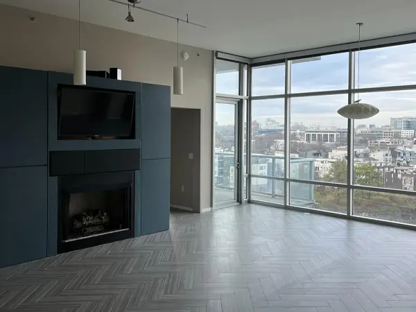 interior painting project of walls and fireplace in olive green and navy blue