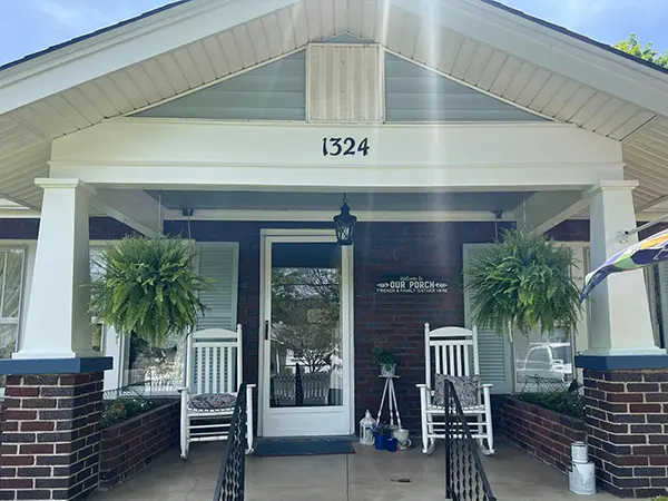 home with wood and brick with a staircase