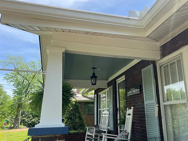 a porch with a white roof