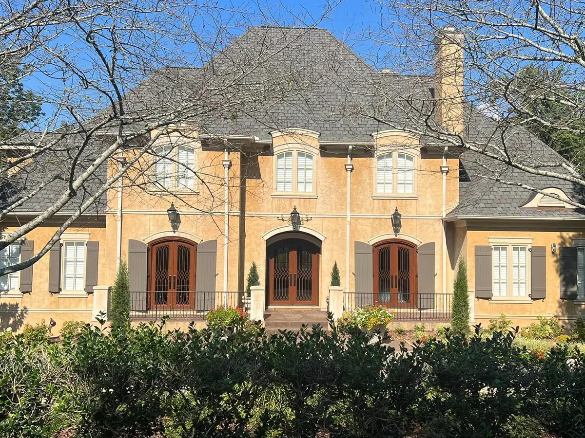 big home mansion with yellow exterior