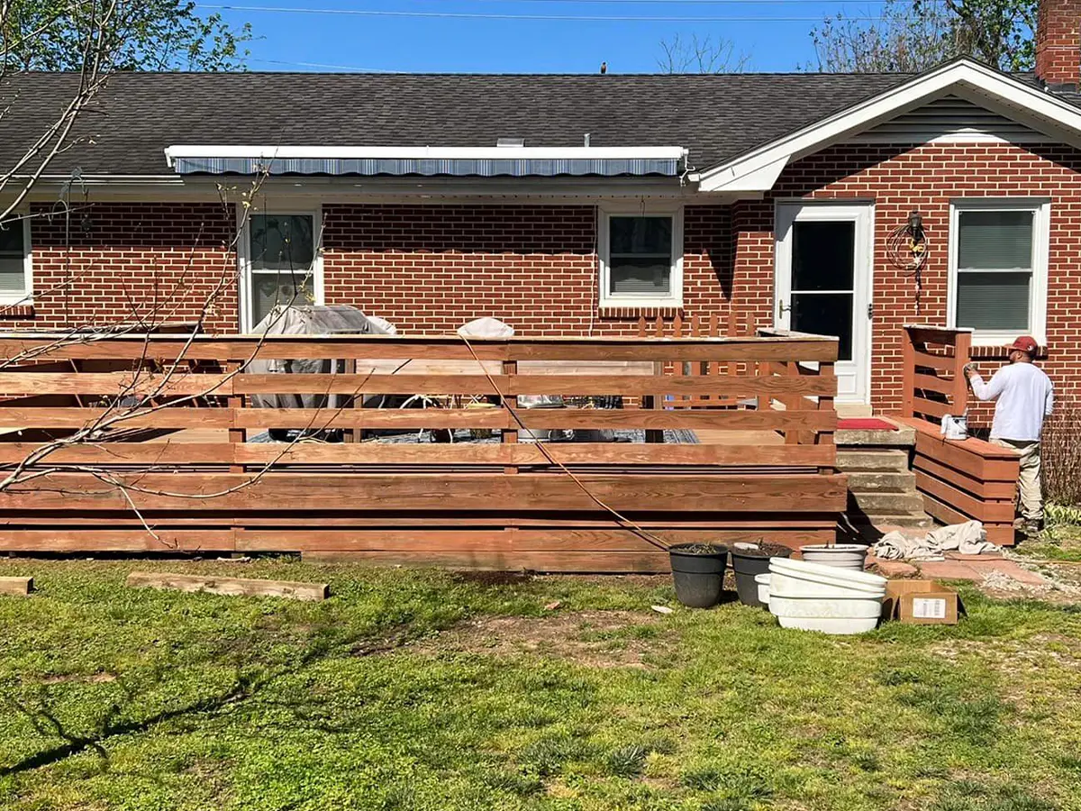 a house with a deck and fence